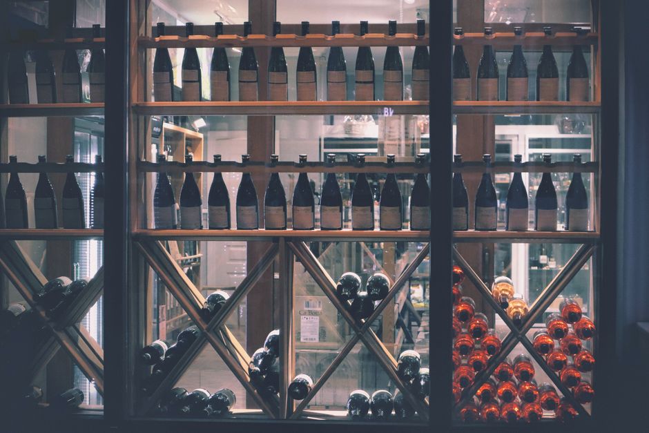Imported wine bottles on retail shelves