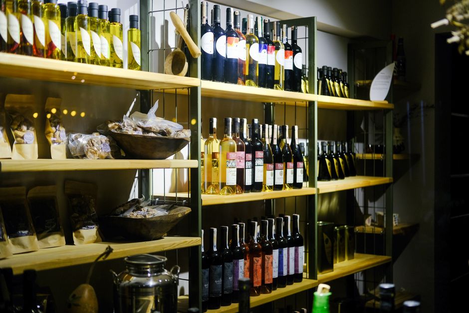 Wine bottles displayed on marketplace shelves
